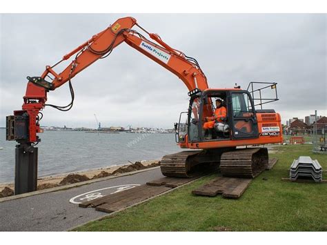 mini digger pile driver|excavator pile attachments.